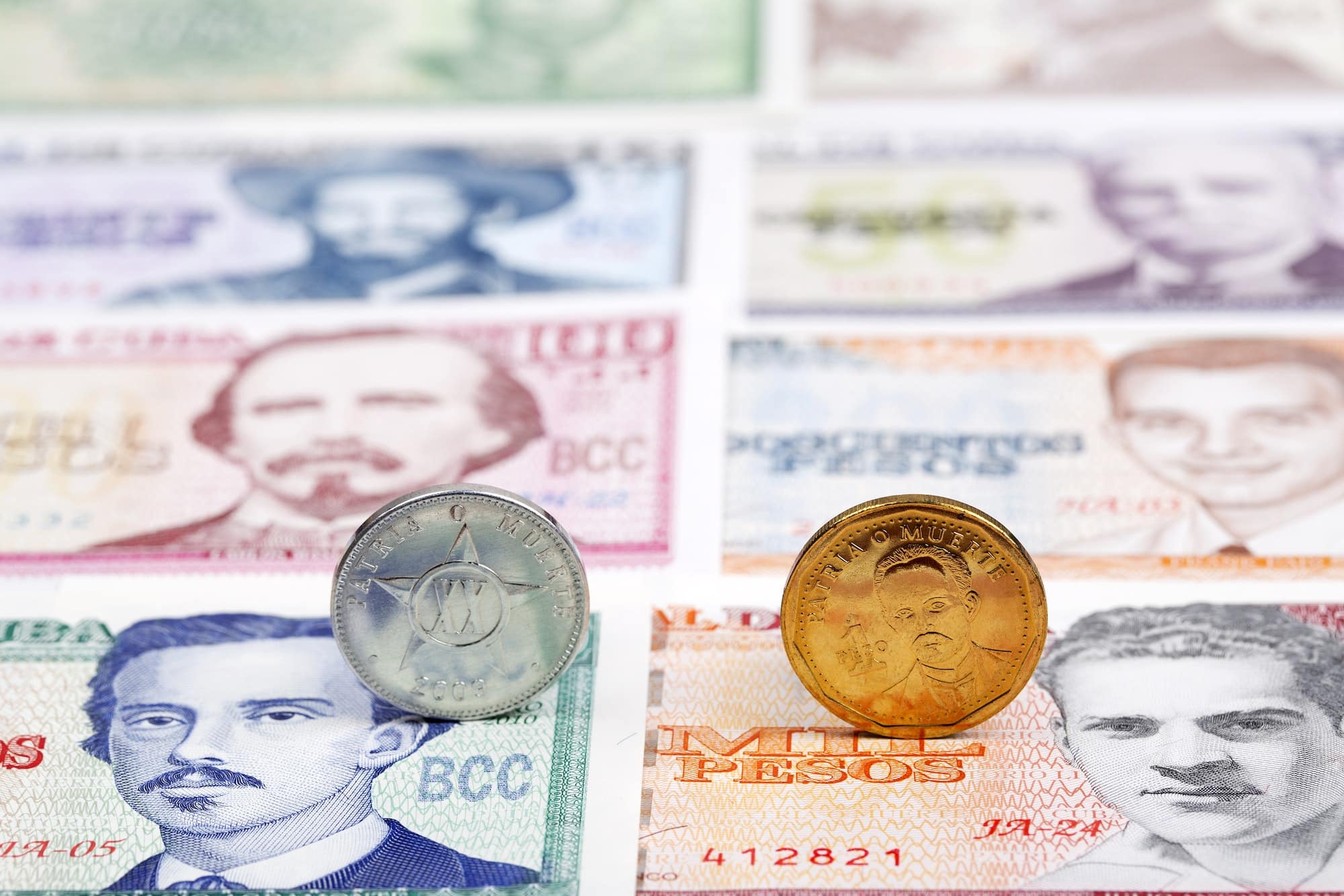 Cuban coins on a background of money
